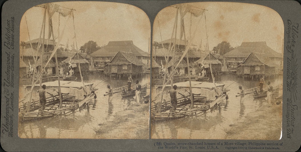 Quaint, straw-thatched houses of a Moro village, Philippine section of the World’s Fair, St. Louis, U.S.A.